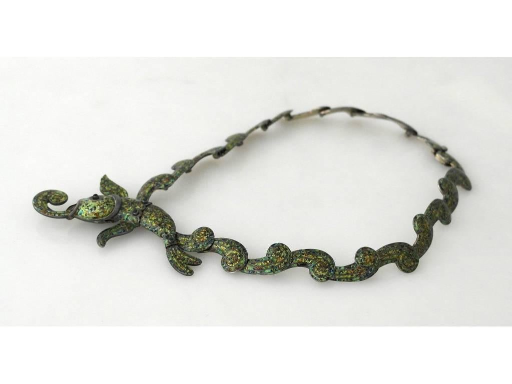 Being offered is a circa 1950 sterling silver and enamel necklace by Margot de Taxco of Taxco, Mexico.

Arguably the most iconic Margot De Taxco necklace in green confetti enamel.  

Pictured in several books:  in green in Margot Van Voorhies, The