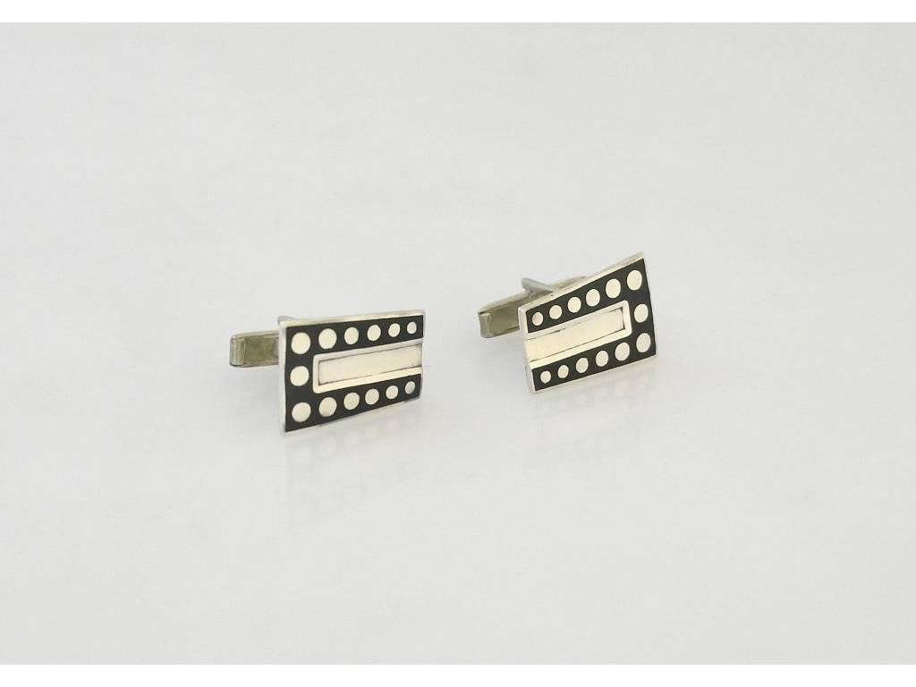 Being offered an extraordinary pair of Margot De Taxco sterling silver modernist enamel cufflinks, #5586A, with an art deco feel.  Dimensions 5/8 inches by 7/8 inches.  Marked.  In excellent condition.
