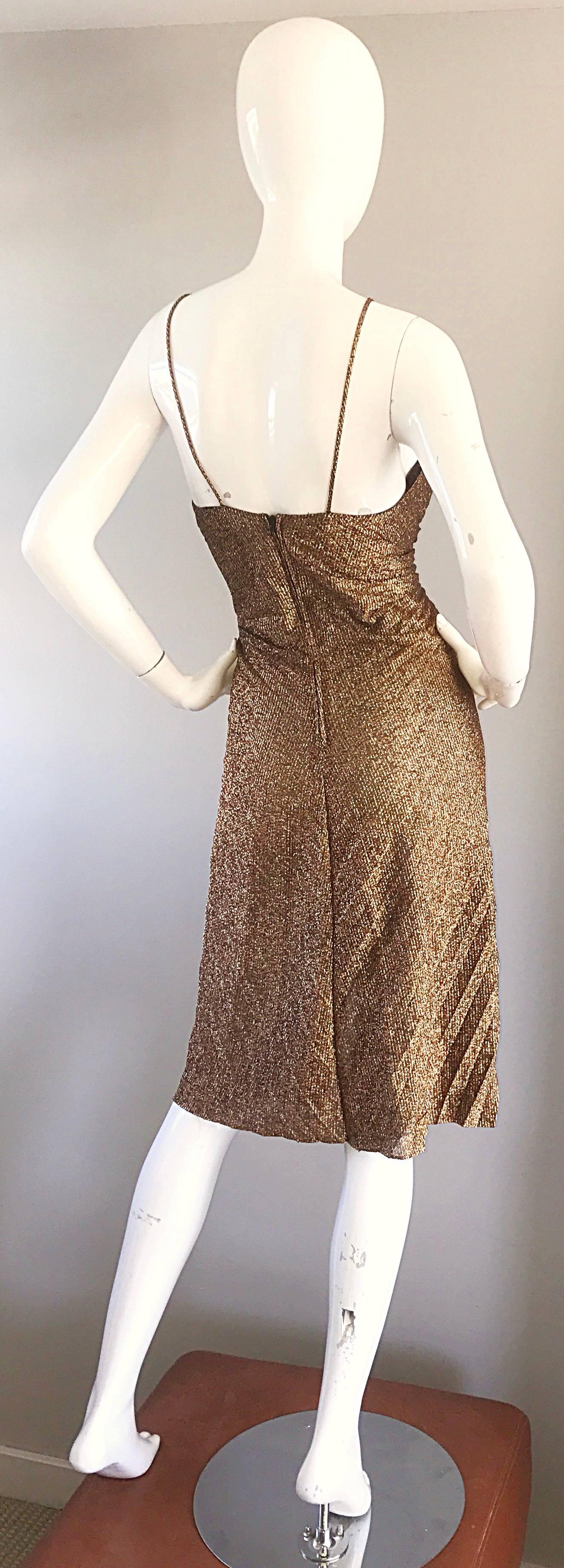 Sexy vintage SAMIR 1970s golden / bronze disco dress! Features flattering accordian pleated throughout. Slinky, flattering fit, with thin spaghetti straps. Seven fabric covered mock buttons up the bodice. Hidden zipper up the back. Can easily be