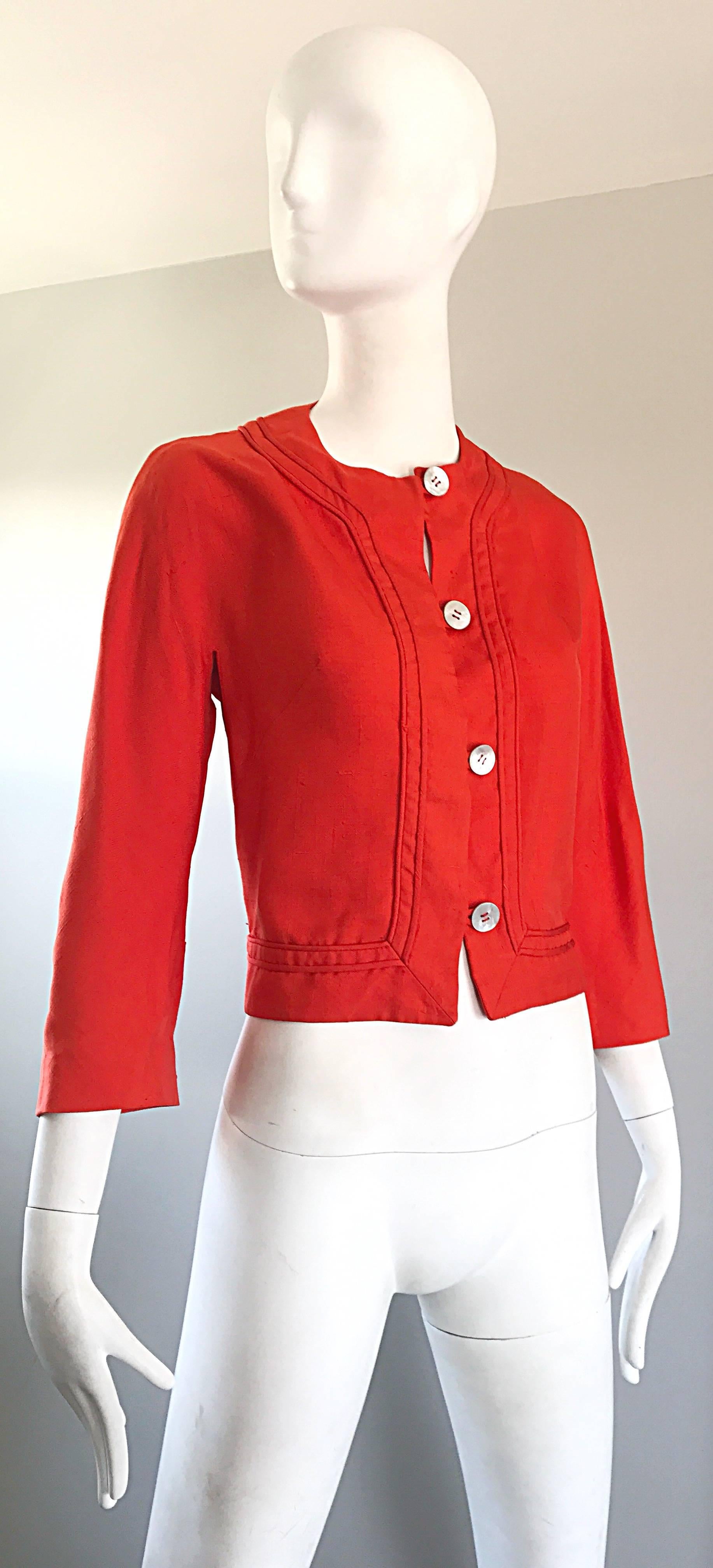 Chic and rare 1960s ABERCROMBIE & FITCH orange linen cropped jacket! Features luxurious soft Irish linen and original mother of pearl round buttons up the front. Can easily be dressed up or down with shorts, jeans, trousers, or a skirt. Would look