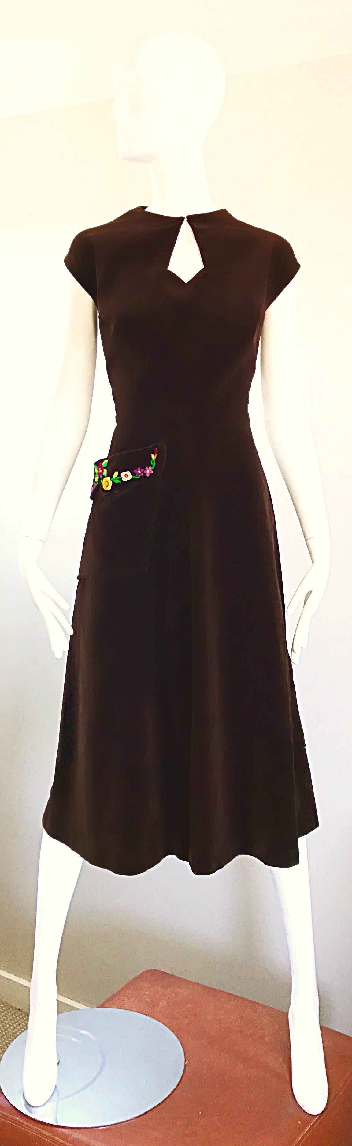 Rare 1940s MARTHA GALE chocolate brown velvet dress! Features soft brown velvet, with a pocket on the right side hip with hand embroidered bright flowers. Keyhole detail above the bust with hook-and-eye closure. Full metal zipper up the side with