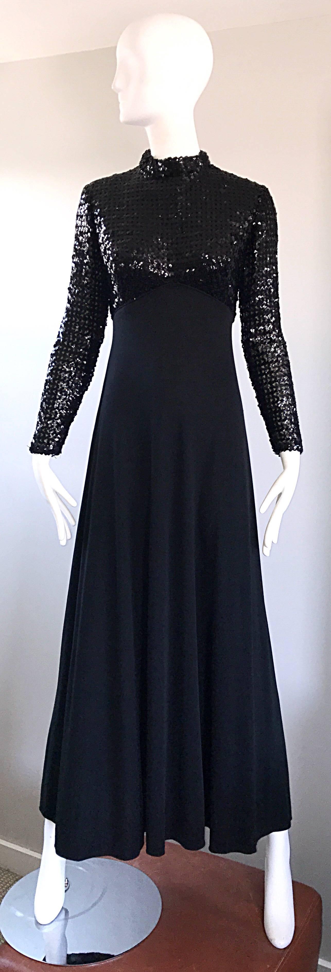 Amazing 1970s black sequin + jersey evening maxi dress! Features a fitted high neck bodice encrusted with hundreds of hand-sewn black sequins. Long tailored sleeves. Liquid jersey looks fantastic with movement. Full metal zipper up the back with