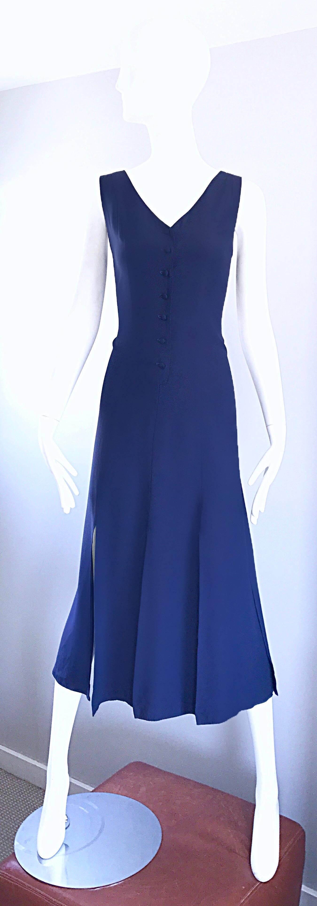 Rare and exceptional vintage GEOFFREY BEENE navy blue rayon car wash hem dress! Fitted bodice features functional black buttons up the front, which leads to a free flowing skirt with split panels. Looks amazing when worn, especially on the dance