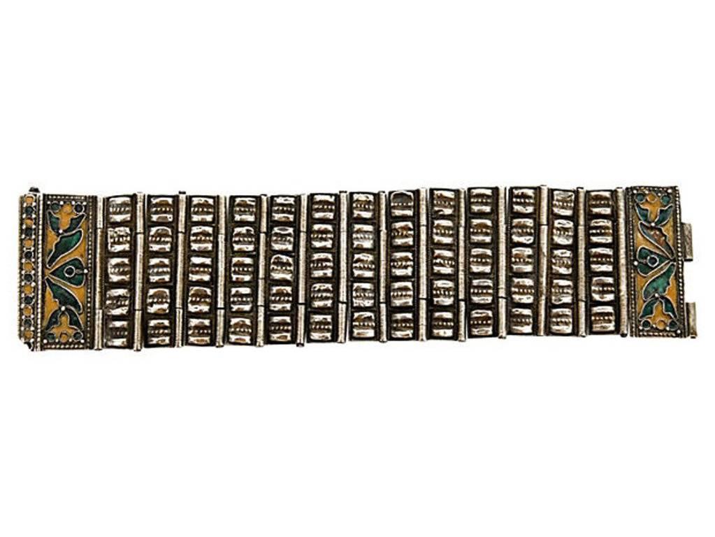 Chinese silver hinged cuff bracelet with enameled closure. Unsigned.
N.P. Trent has been a respected name in antiques for over 30 years with a large collection of antique and vintage fashion and jewelry. 
