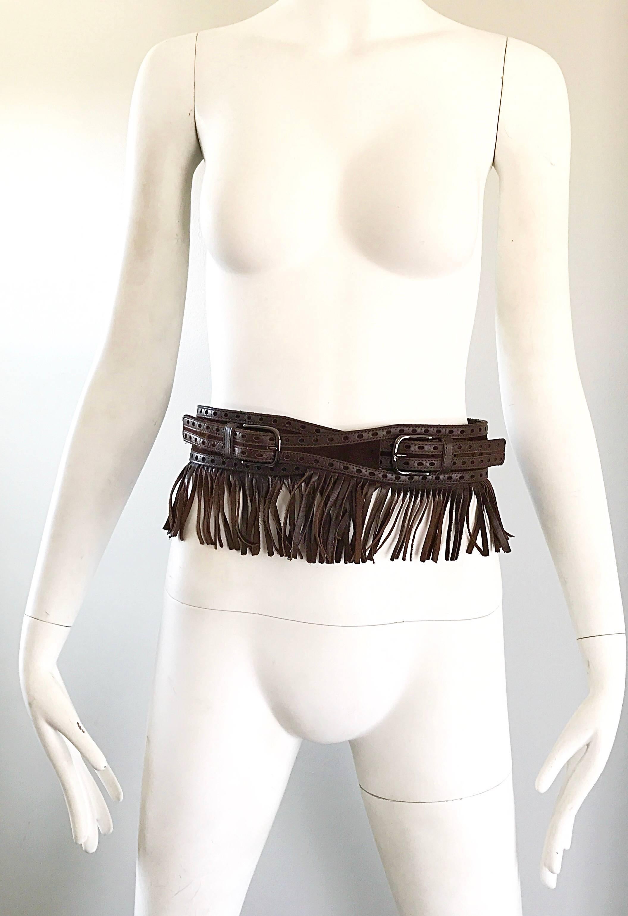 Rare chic 1970s YSL YVES SAINT LAURENT Paris brown leather and suede fringe boho belt! Features brown leather and suede with leather fringe. Double buckle closure will fit an array of sizes. Great with jeans, shorts, a skirt or a dress. 
In great