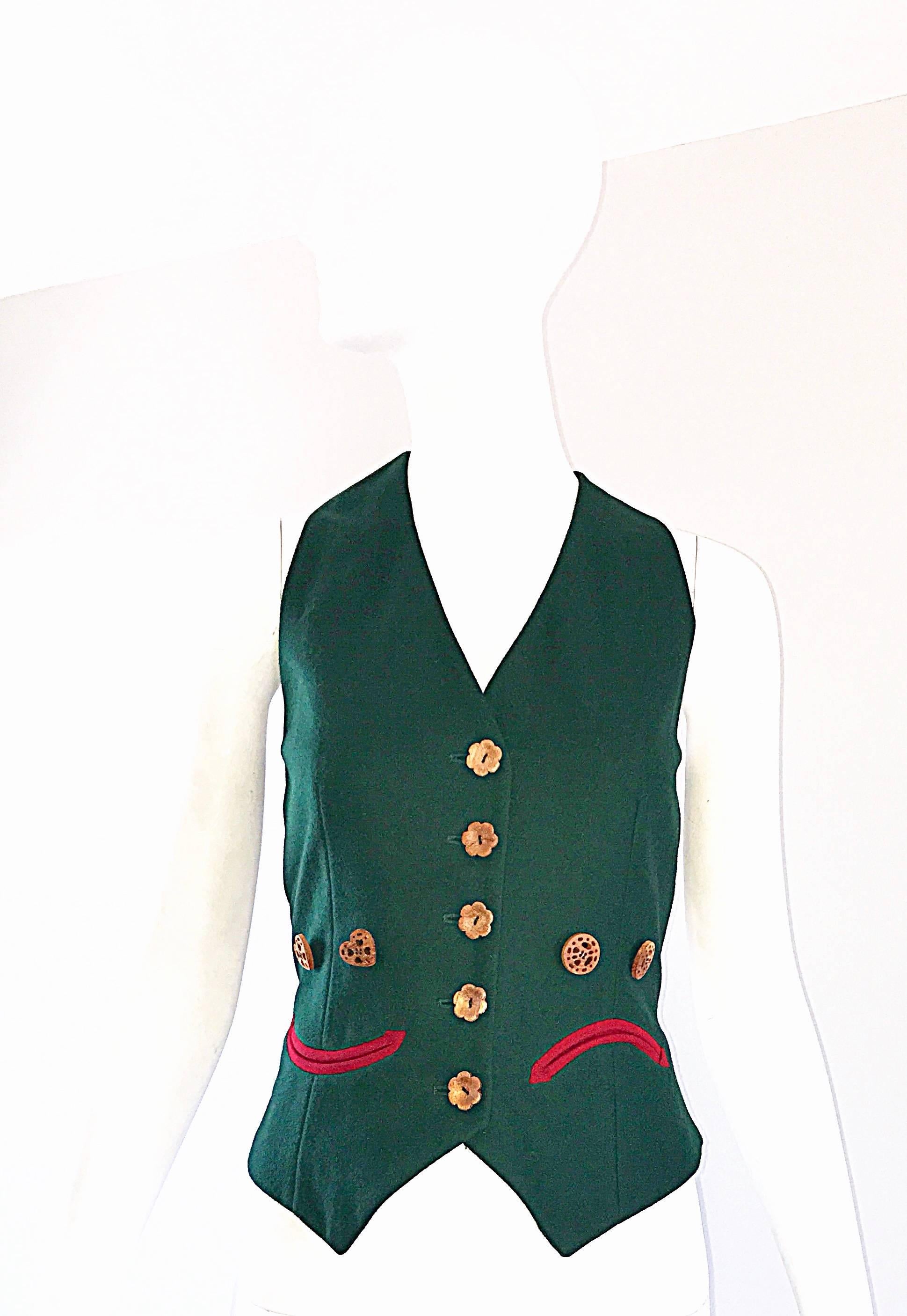 Rare 90s vintage MOSCHINO Cheap and Chic ' Happy / Sad ' carved wooden button cropped vest! Forest green wool, with black and white striped silk back. Peace sign, heart, and clover carved wooden buttons. Happy face pocket on one side of the waist,