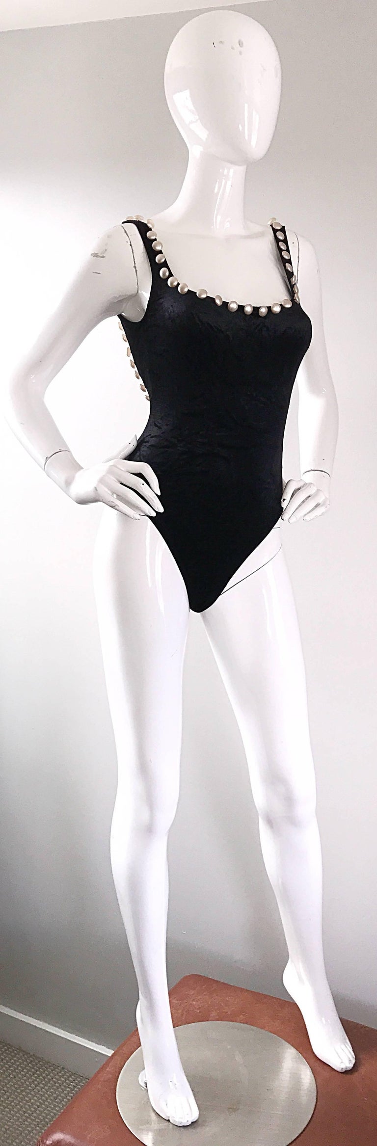 Sexy 90s MOSCHINO black velour bodysuit, encrusted with white pearls! Features a soft crushed velour that stretches to fit. Flat headed pearls adorn the top portion on the front and back. Can be worn as a bodysuit or a one piece swimsuit. Great with