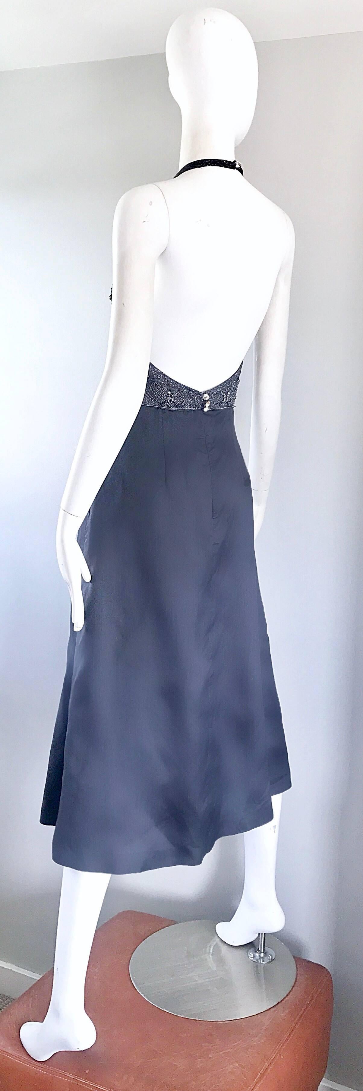 Make a statement in this 1990s PAMELA DENNIS COUTURE charcoal gray virgin wool and silk midi halter dress! Fitted bodice features thousands of hand-sewn beads, sequins, pearls and rhinestones throughout. Sexy low cut back features just the right