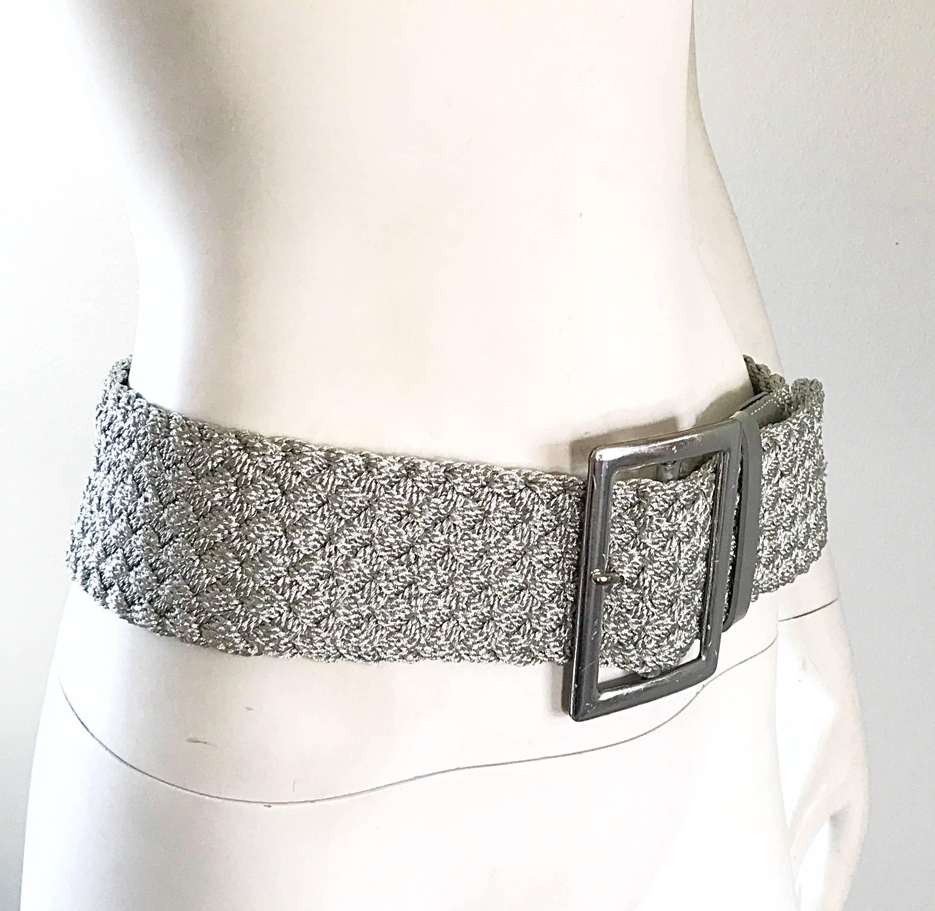 Statement making 90s RALPH LAUREN COLLECTION Purple Label silver metallic braided jumbo belt! Features a silver leather buckle, with a stretch rayon braided belt. Perfect with trousers, a skirt, or over a dress or jacket. 
In great condition. Made
