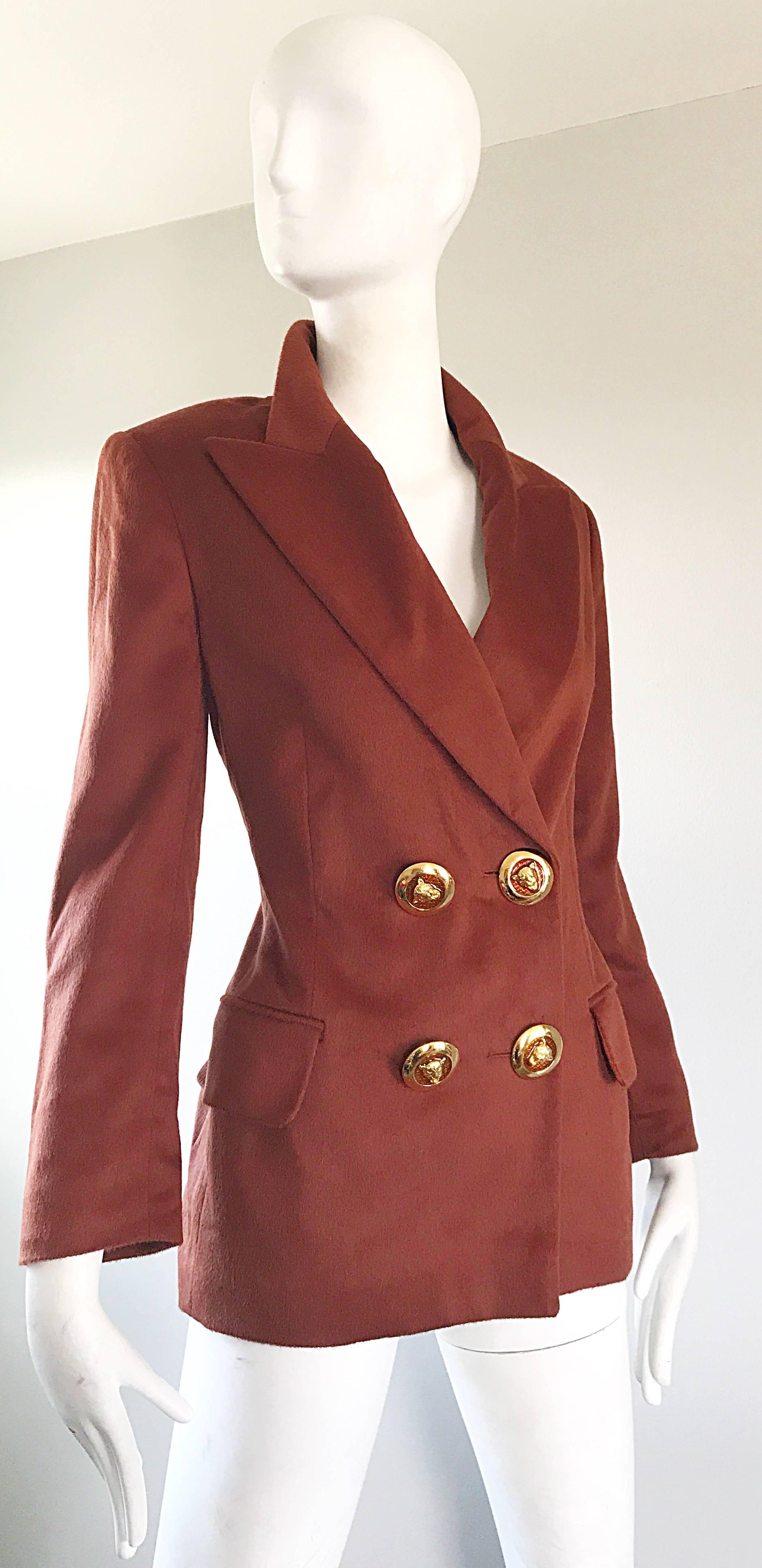 Chic, with a twist, 1990s ESCADA by MARGARETHA LEY rust / brown colored double breasted boyfriend blazer jacket! Features four large gold and amber lion head buttons on the front. Hidden interior buttons for extra support. Pockets at each side of