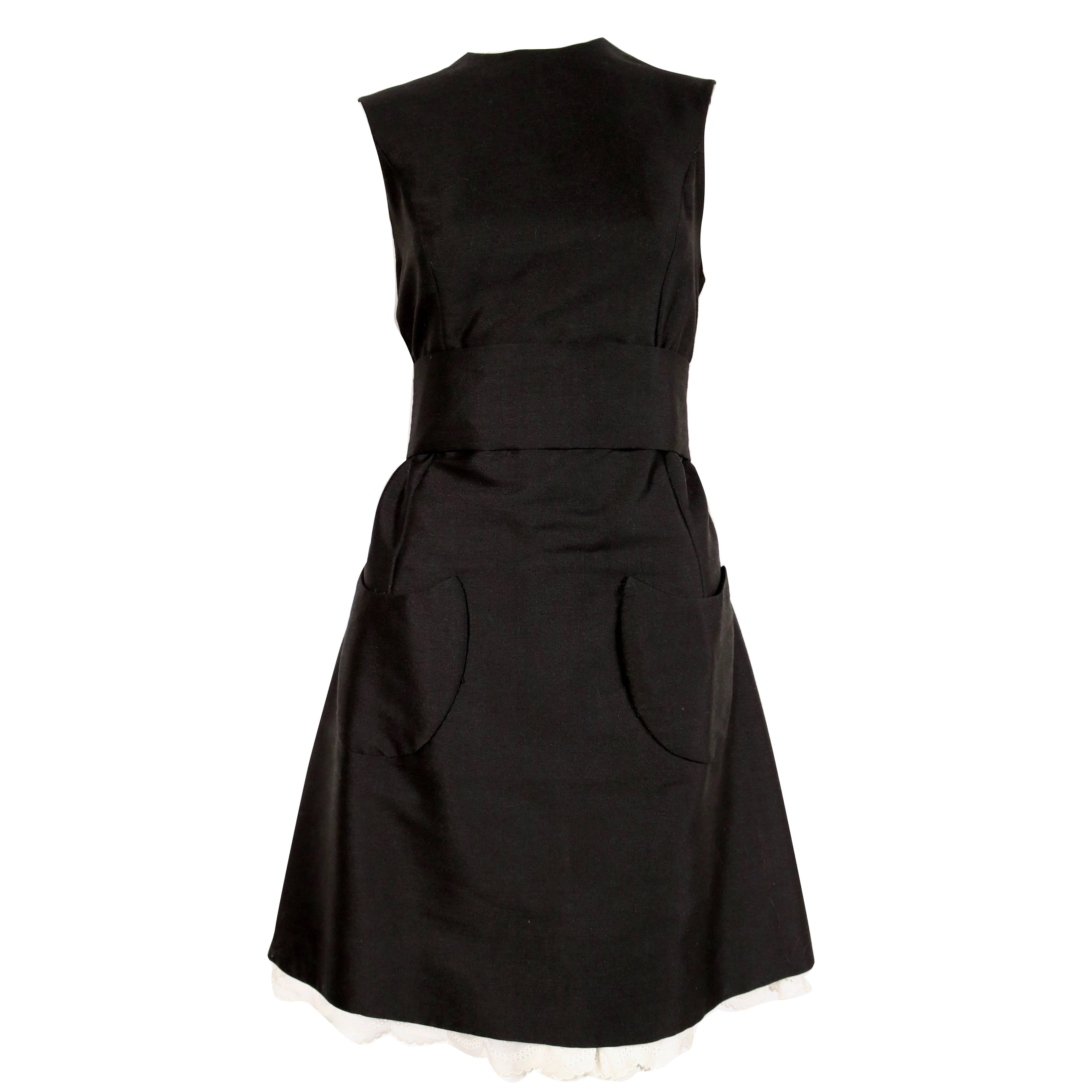 Antonio del Castillo black wool dress with patch pockets and lace trim, 1960s  For Sale