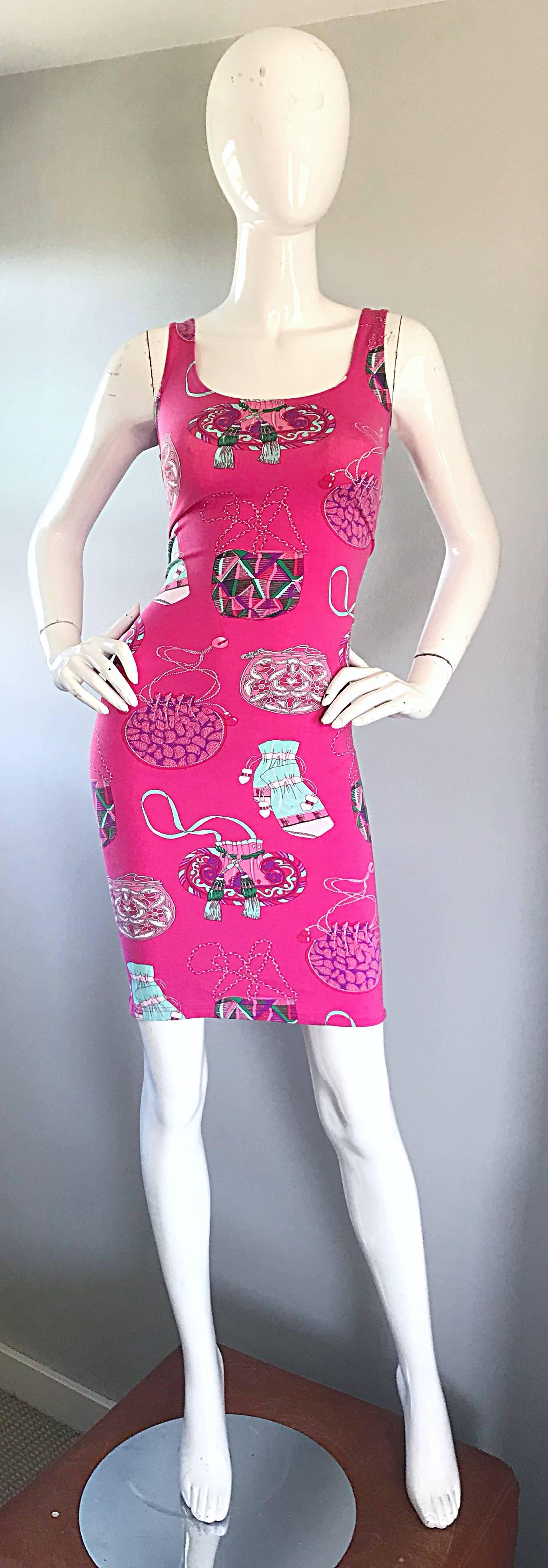 Sexy and fun new with tags vintage MANUEL CANOVAS hot pink bodycon 90s dress! Features handbags from different eras throughout. Simply slips over the head and stretches to fit. Great with sandals or wedges for day, and heels or boots for night. 
In