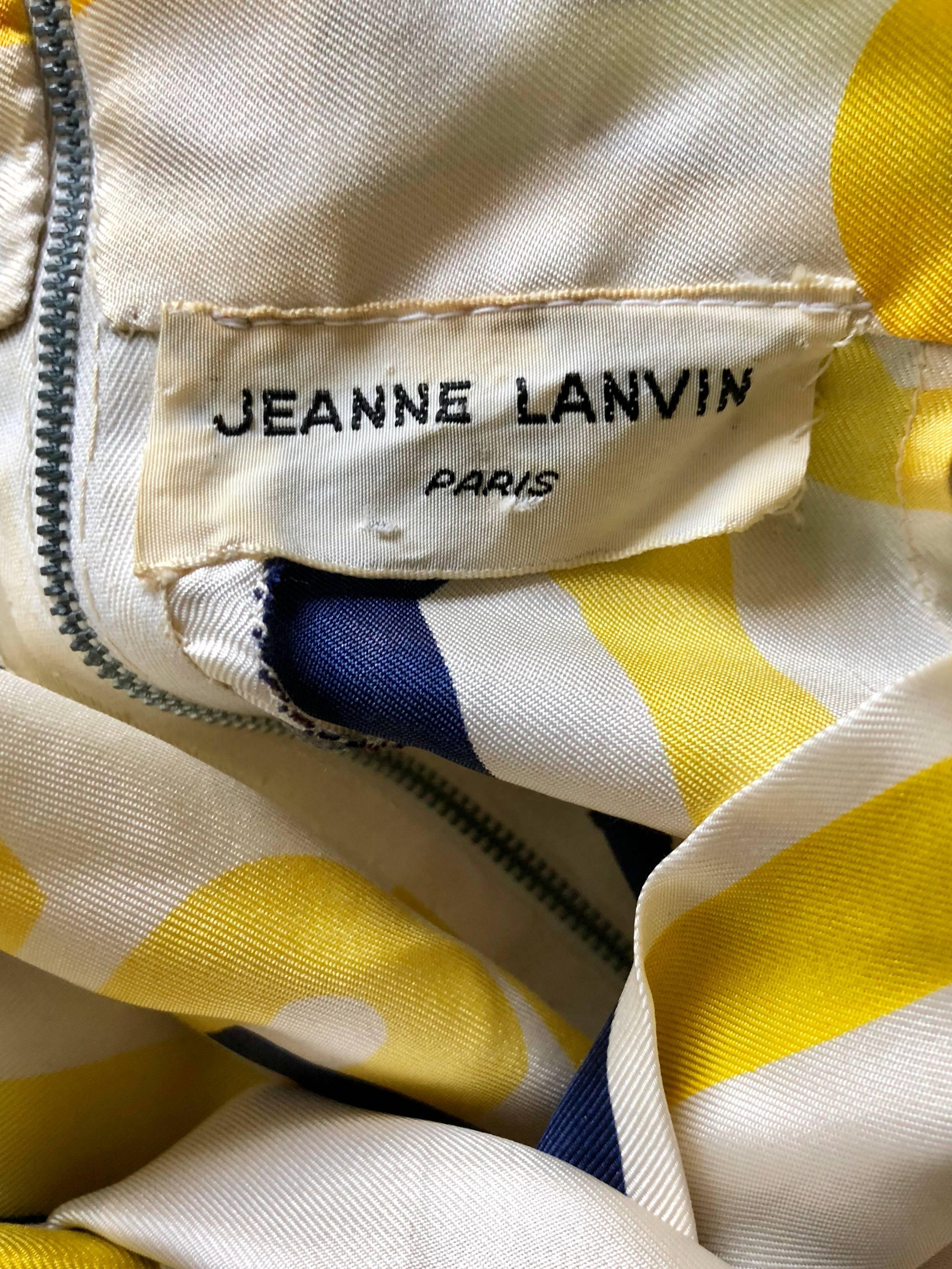 Chic 1960s JEANNE LANVIN couture navy blue, yellow and white sleeveless nautical silk top! Features a chain print throughout. Attached scarf at neck can be left down or tied into a pussycat bow. Full metal zipper up the back with hook-and-eye