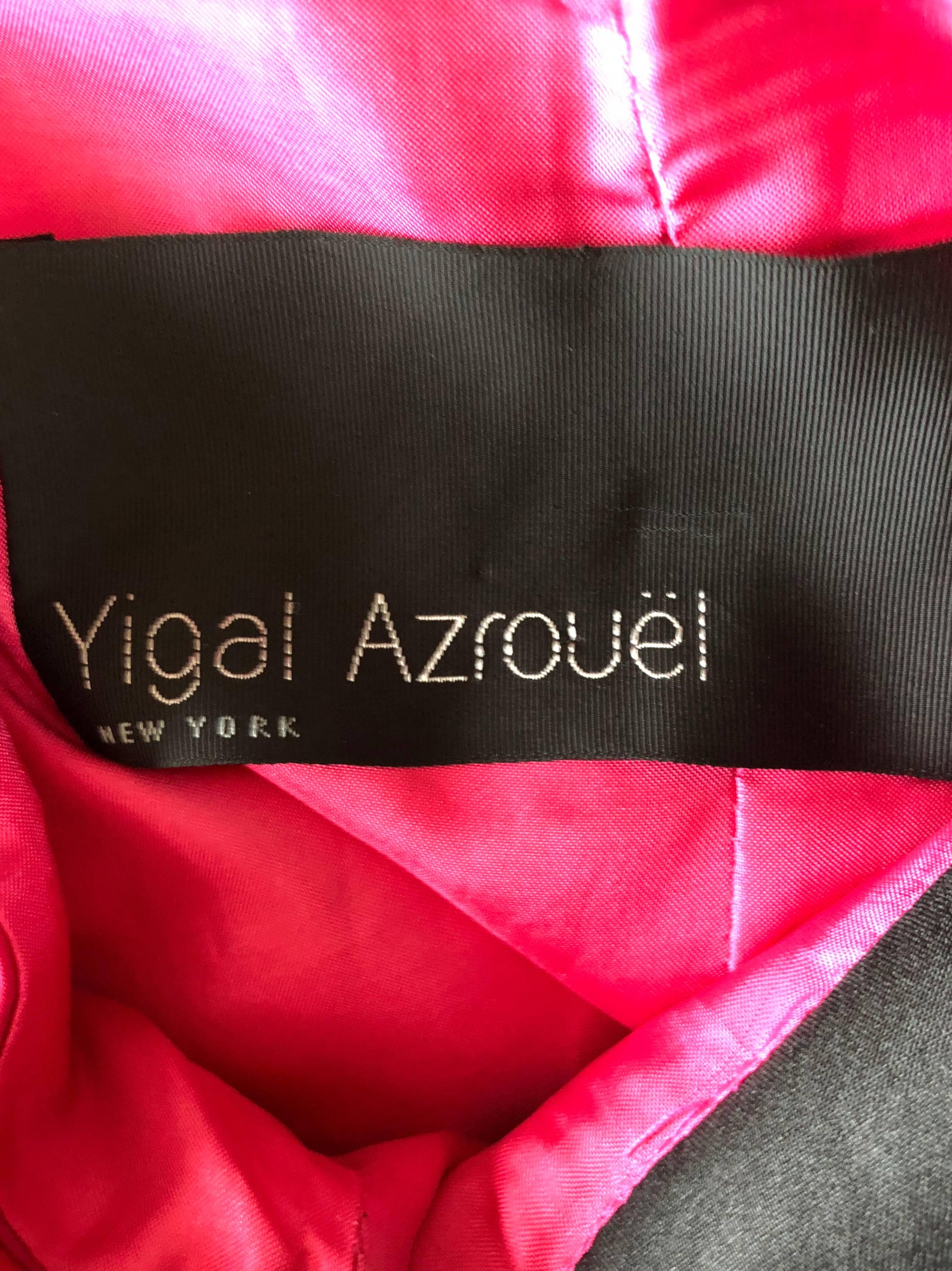 Sexy YIGAL AZROUEL hot pink / fuchsia and black color block shift dress! Features an open back that reveals just the right amount of skin. Pockets at each side of the hips. Hidden zipper up the side with hook-and-eye closure. Great for any day or