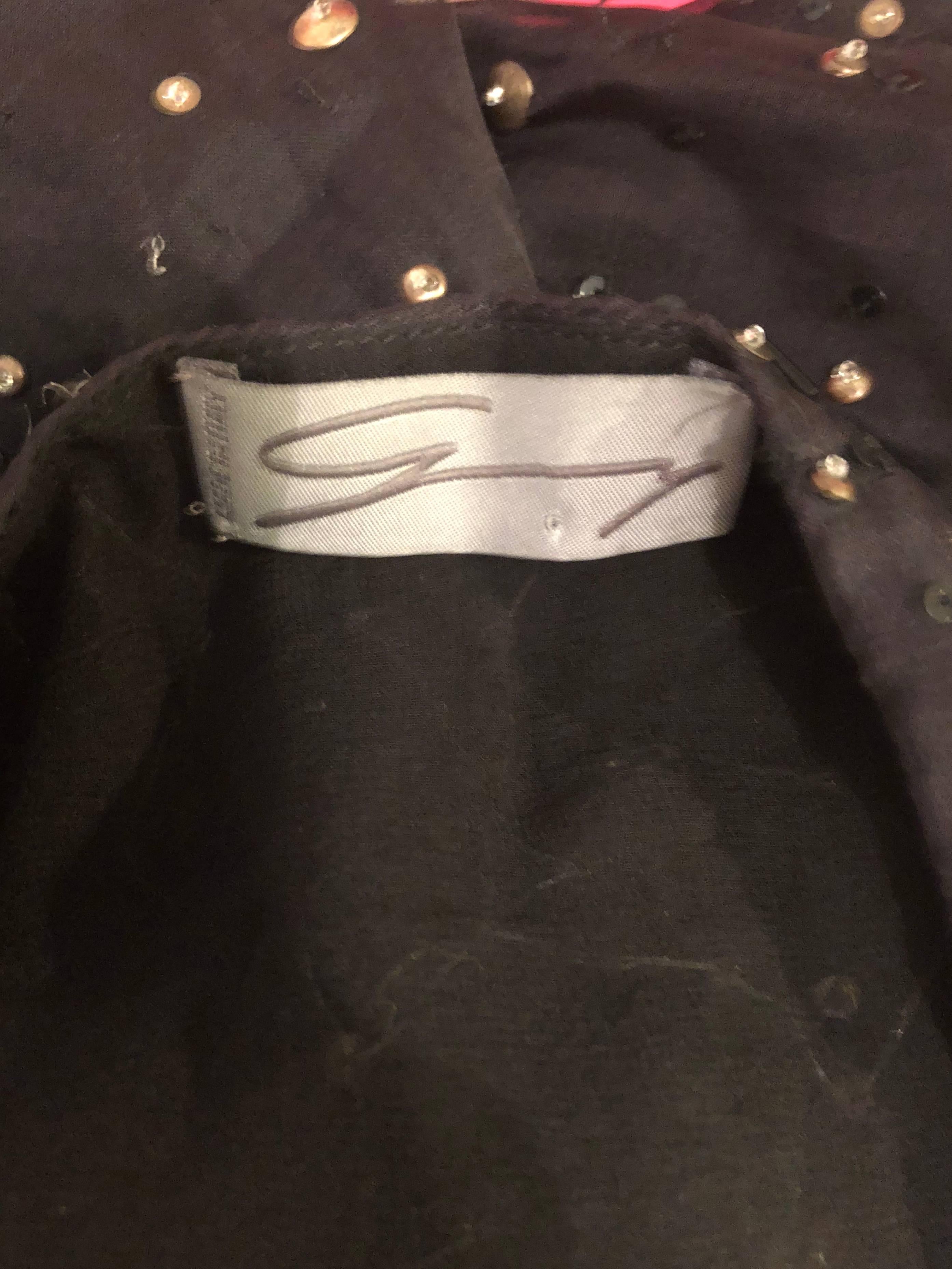 Beautiful 90s GENNY, by GIANNI VERSACE black silk chiffon semi sheer beaded blouse! Features hundreds of hand-sewn black beads and gold sequins throughout. Hidden zipper up the side with hook-and-eye closure. Can easily be dressed up or down.