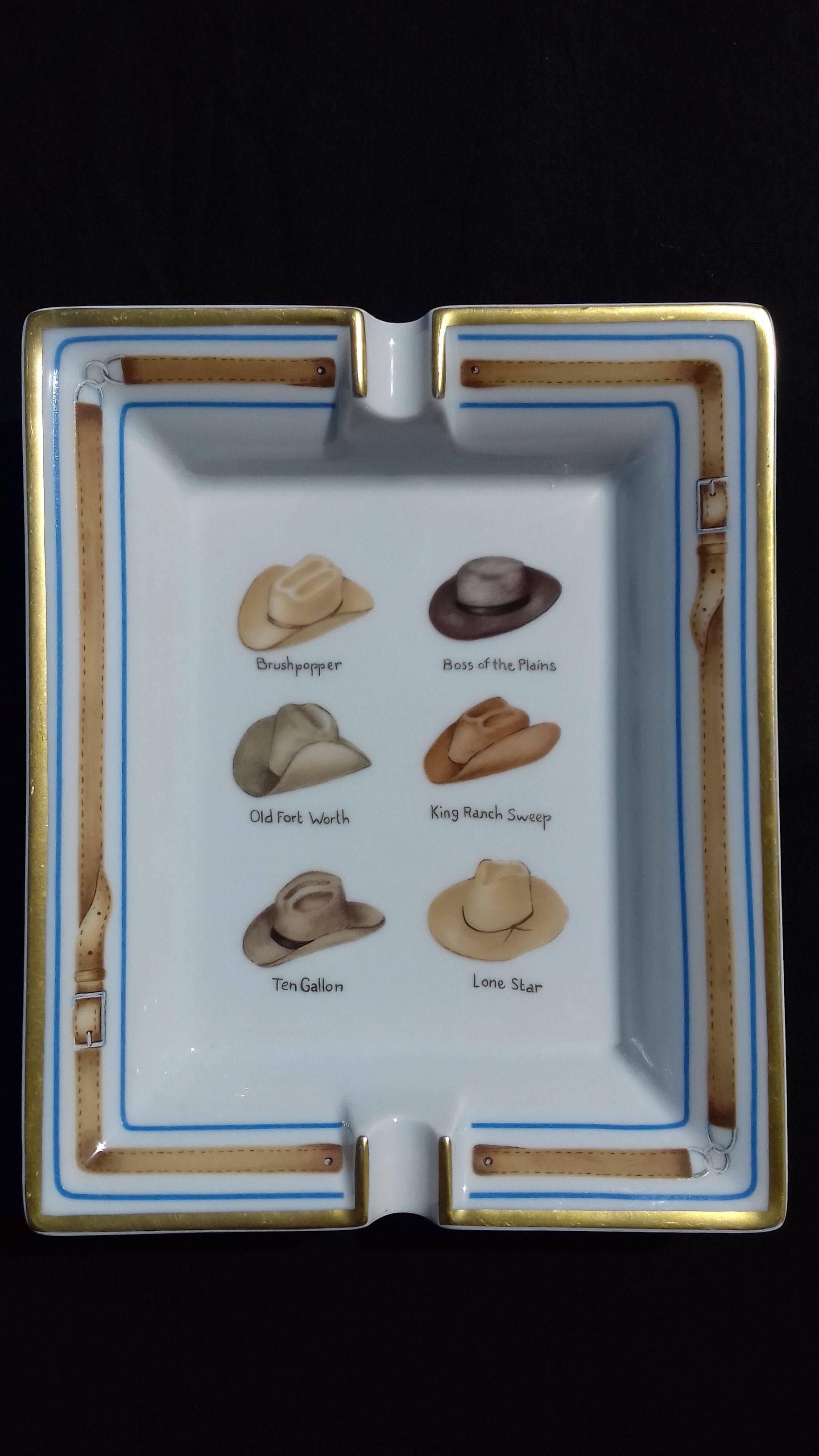 Gorgeous Authentic Hermes Ashtray

Pattern: Drawings of 6 cowboy hats (Brushpopper/Boss of the Plains/Old Fort Worth/Kind Ranch Sweep/Ten Gallon/Lone Star)

Made in France

Made of Printed Limoges Porcelain

Colorways: White Background, Brown and