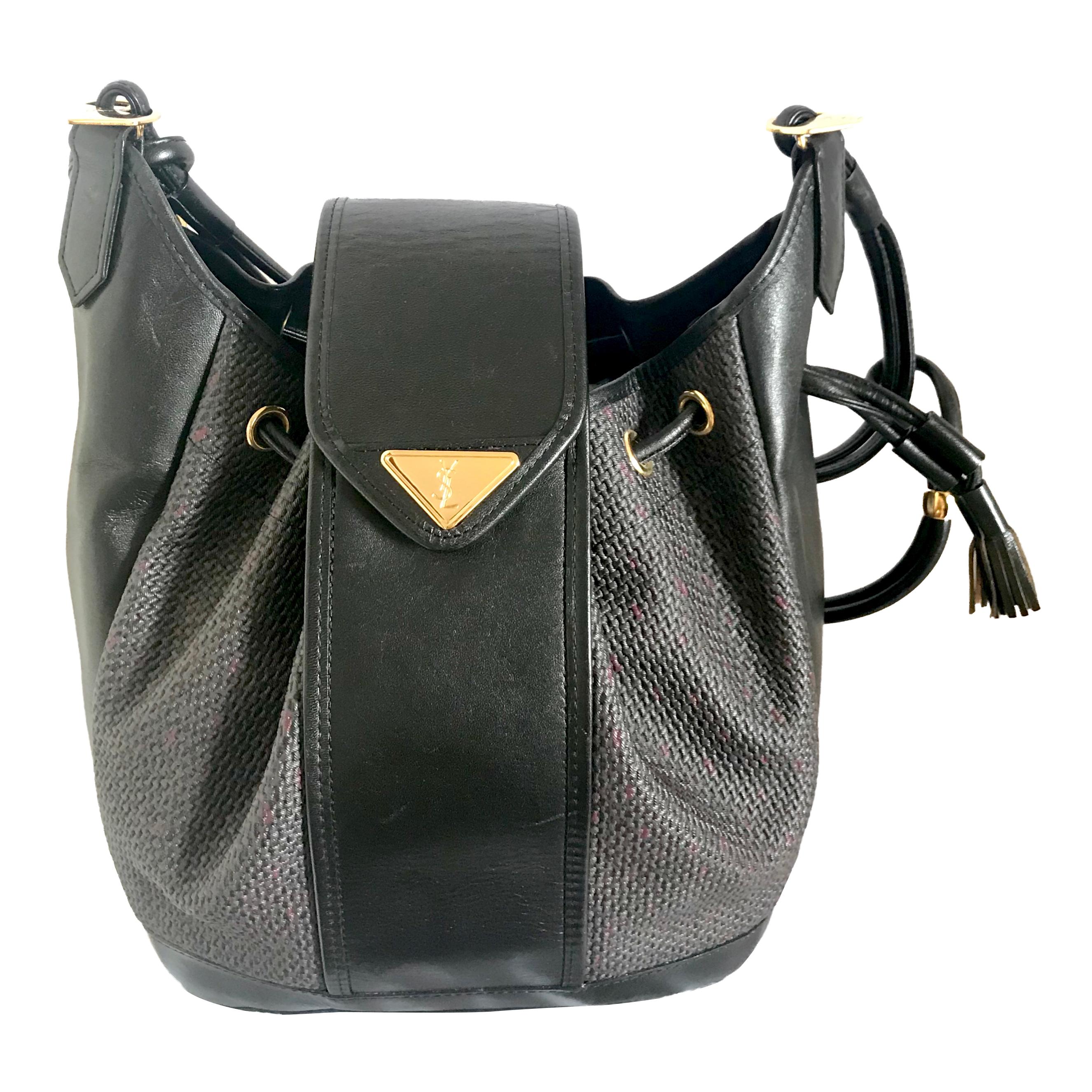 Yves Saint Laurent Vintage black hobo bucket shoulder bag with golden YSL motif For Sale