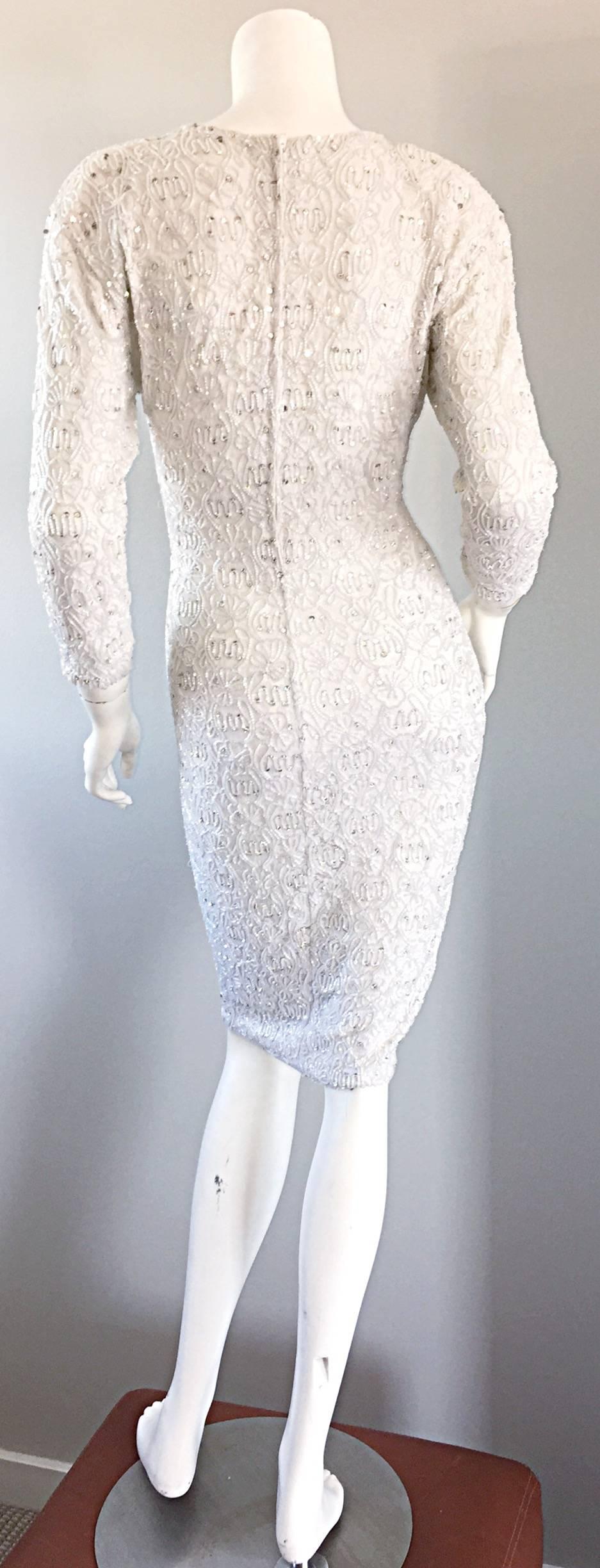 Incredible, sexy, and timeless vintage 1980s Giorgio di Sant Angelo white beaded dress! Encrusted with thousands of seed beads, rhinestones, etc...The detail on this sexy little number are out of this world! Bodycon fit, with a ton of stretch, that