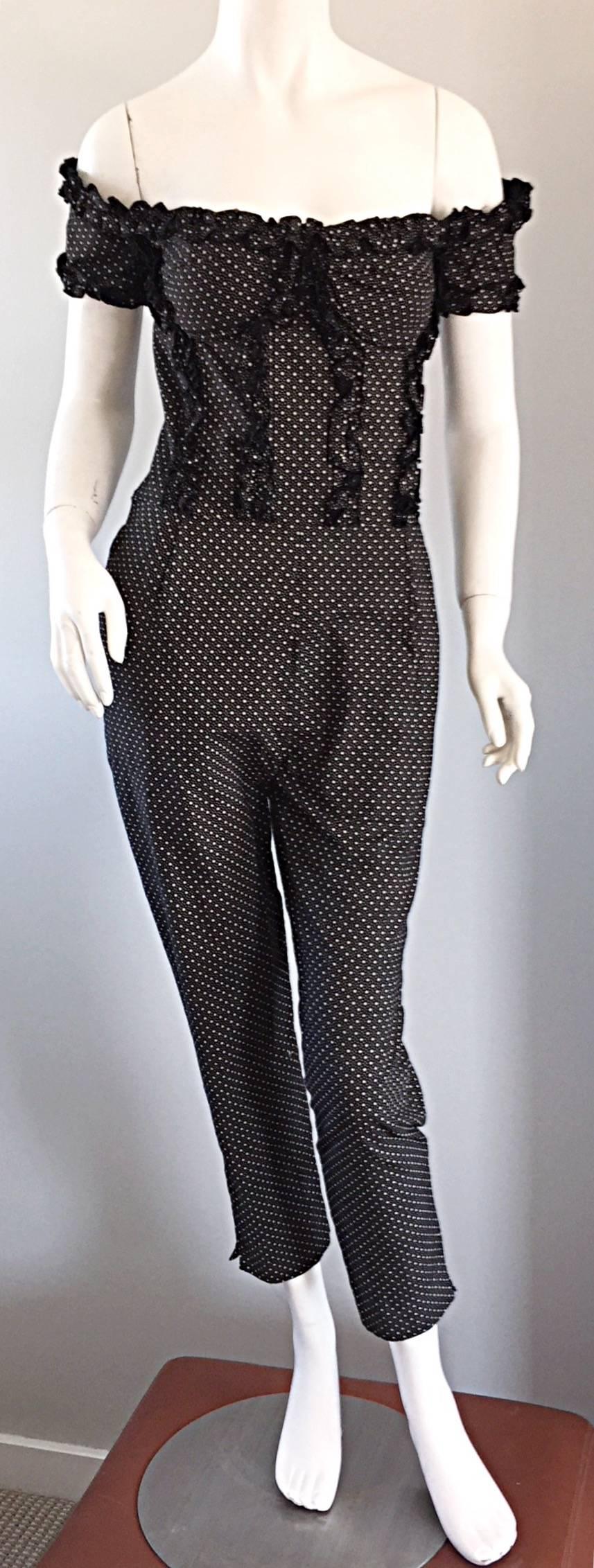 Wonderful vintage 80s Brioni jumpsuit! Amazing fit, with an insane amount of detail! Ruffles down the boned corset, and at sleeves. Sits slightly off the shoulder. Cropped trousers, with side vents on each leg opening. Can easily transition from day