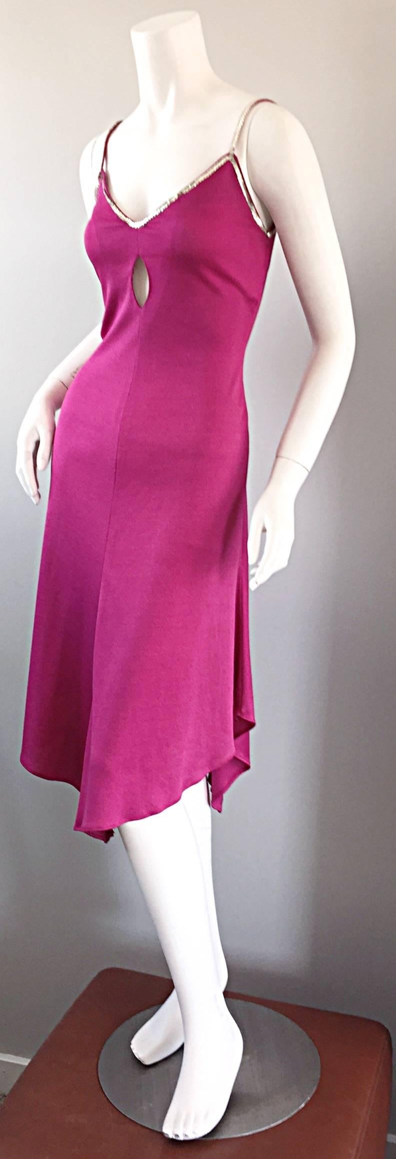 Wonderfully sexy vintage David Howard hot pink / fuchsia 1970s slinky dress! Features cut-out at bodice, with silver sequins at bust, and at straps. Asymmetrical hem, that dips in the front and back. SO utterly flattering on! Looks great with boots,