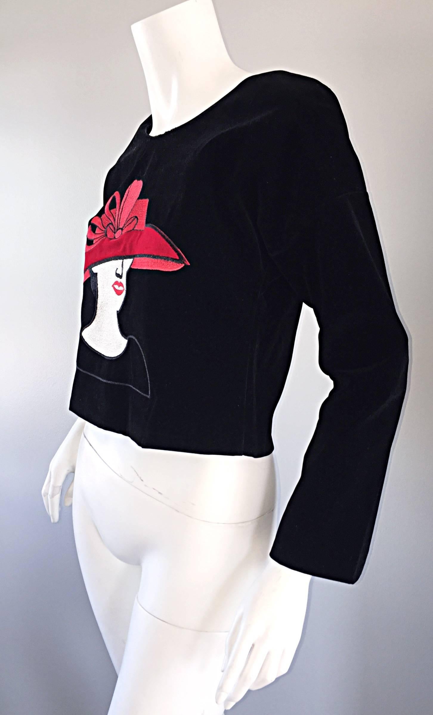 Such a fun and chic vintage cropped blouse! Black velvet, with a hidden zipper up the back. Embroidered with an Asian lady with a red hat. Fully lined, and made very well. Looks great with shorts, jeans, or a skirt. In great condition. Approximately