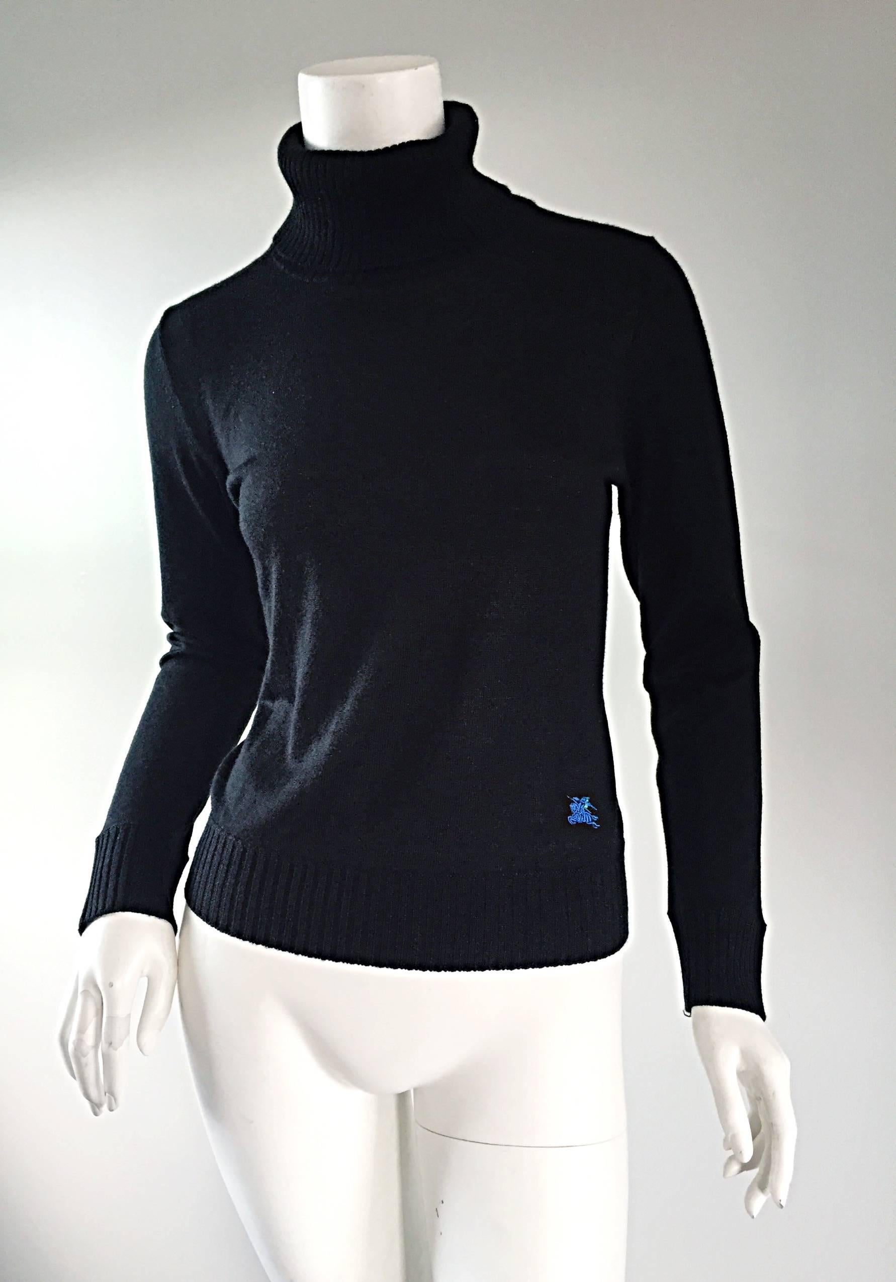 Nice new vintage Burberry turtleneck sweater! An essential fall/winter staple that can easily transition from day to night. Slim, tailored fit,, with signature blue Burberry crest at side waist. Great with jeans, or perfect tucked into a skirt. In