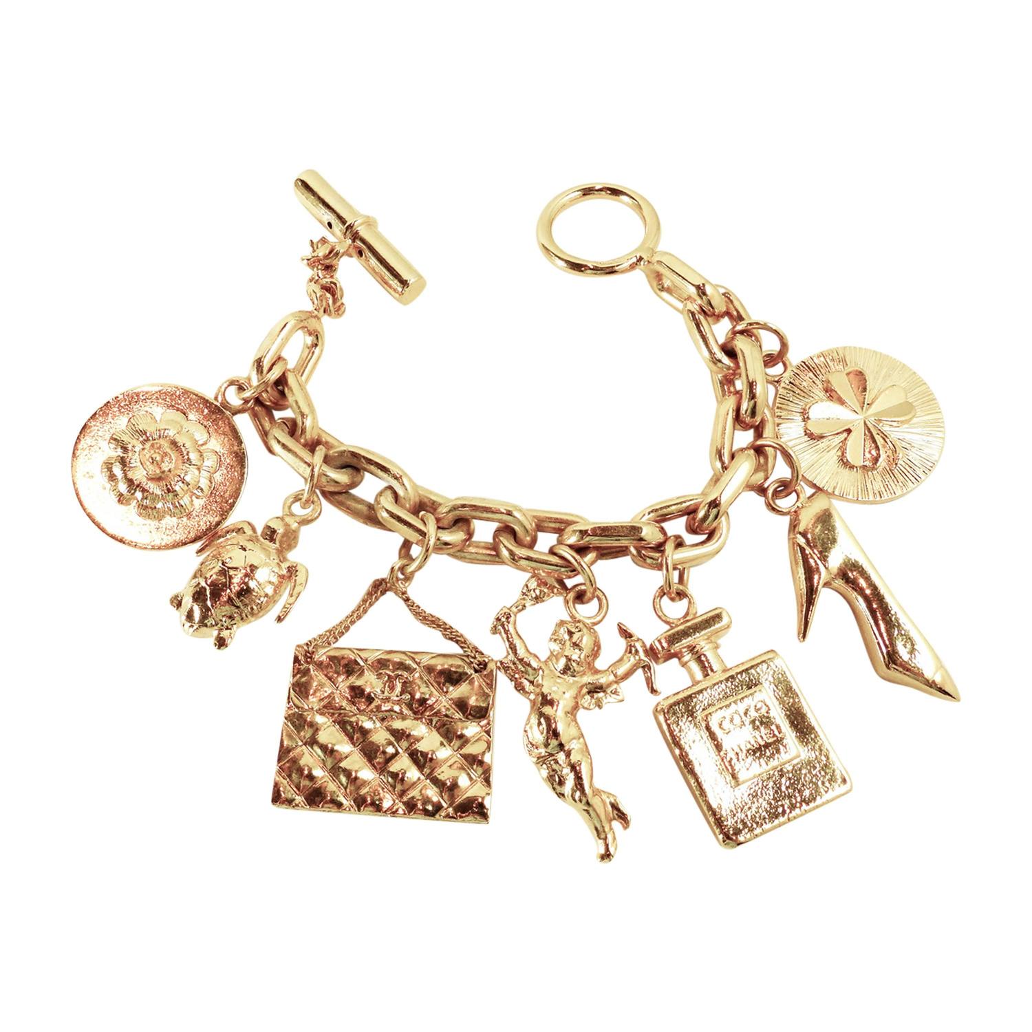 Vintage Chanel Famous Collectible 7 Charms Bracelet For Sale at 1stdibs