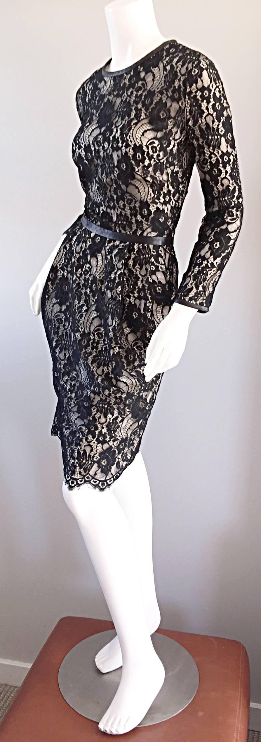 What a stunning Narcisco Rodriguez black and nude lace long sleeve dress! Black silk over nude silk. Leather trimmed at the sleeve cuffs, waist, and collar. This beauty also features PCOKETS at both sides of the waist. Pleating detail at waist that