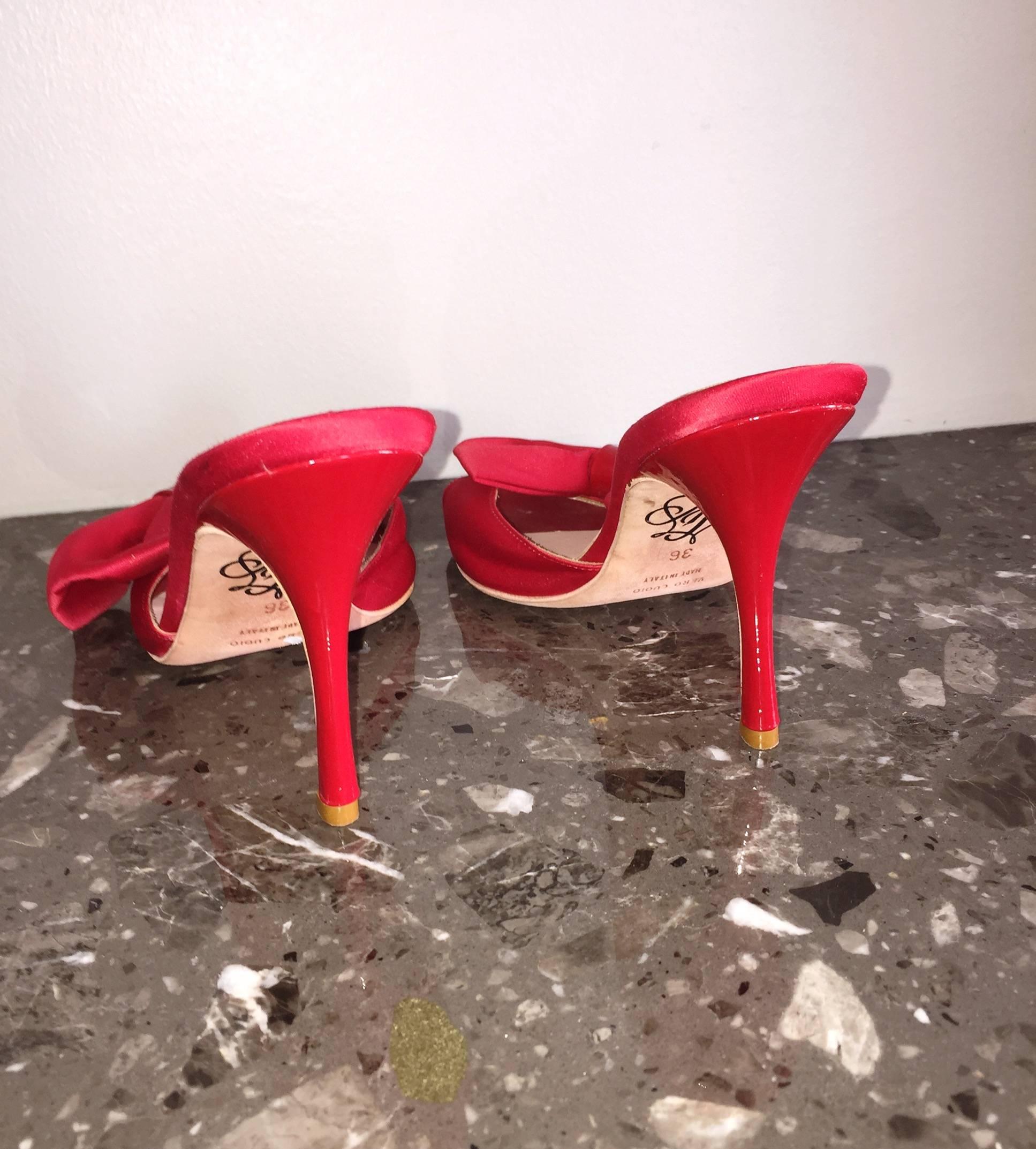 Sexy brand new, never worn  AGENT PROVOCATEUR red satin heels! 1950s sex appeal, with a modern twist. Features a bow at each side, with red patent leather accent. Perfect with jeans or shorts, yet impressive with a dress, or evening gown! Made in