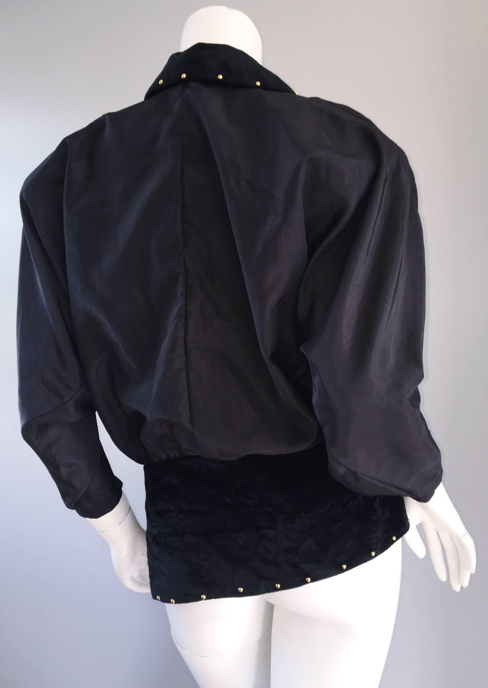 Amazing vintage Eccetera black multi-fabric blouse OR jacket! Velveteen, mixed with silk dolman sleeves, and laser-cut crepe. Gold studs throughout, with clear beads sporadically placed. Brass zipper details at shoulders, down the bodice. Shoulder
