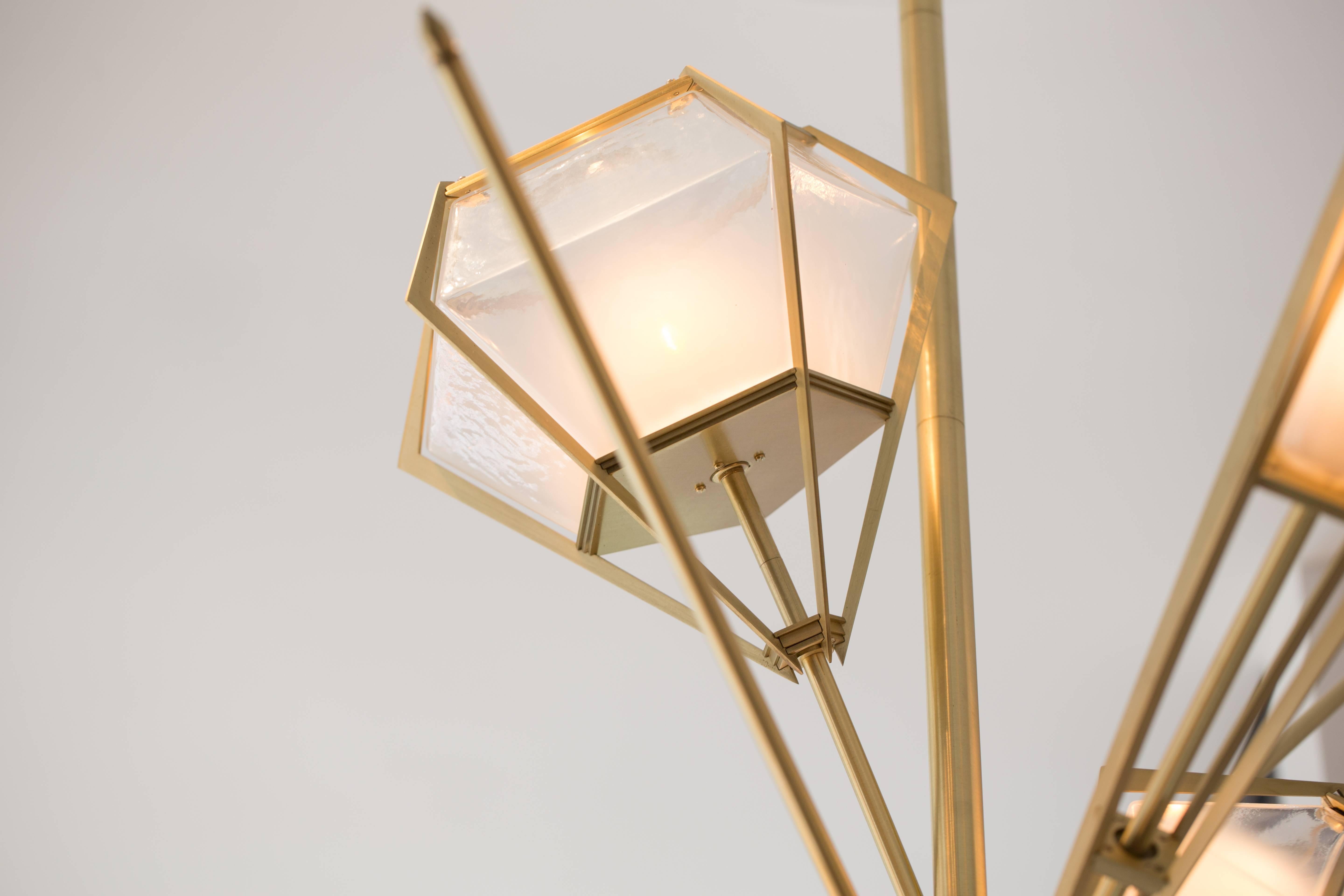Elegant sculptural light-fixture inspired by jewelry design featuring a mold-blown glass gem in a chic metallic setting to create an asymmetrical starburst of light.
Harlow is available in various color ways, and held in a metallic frame referencing