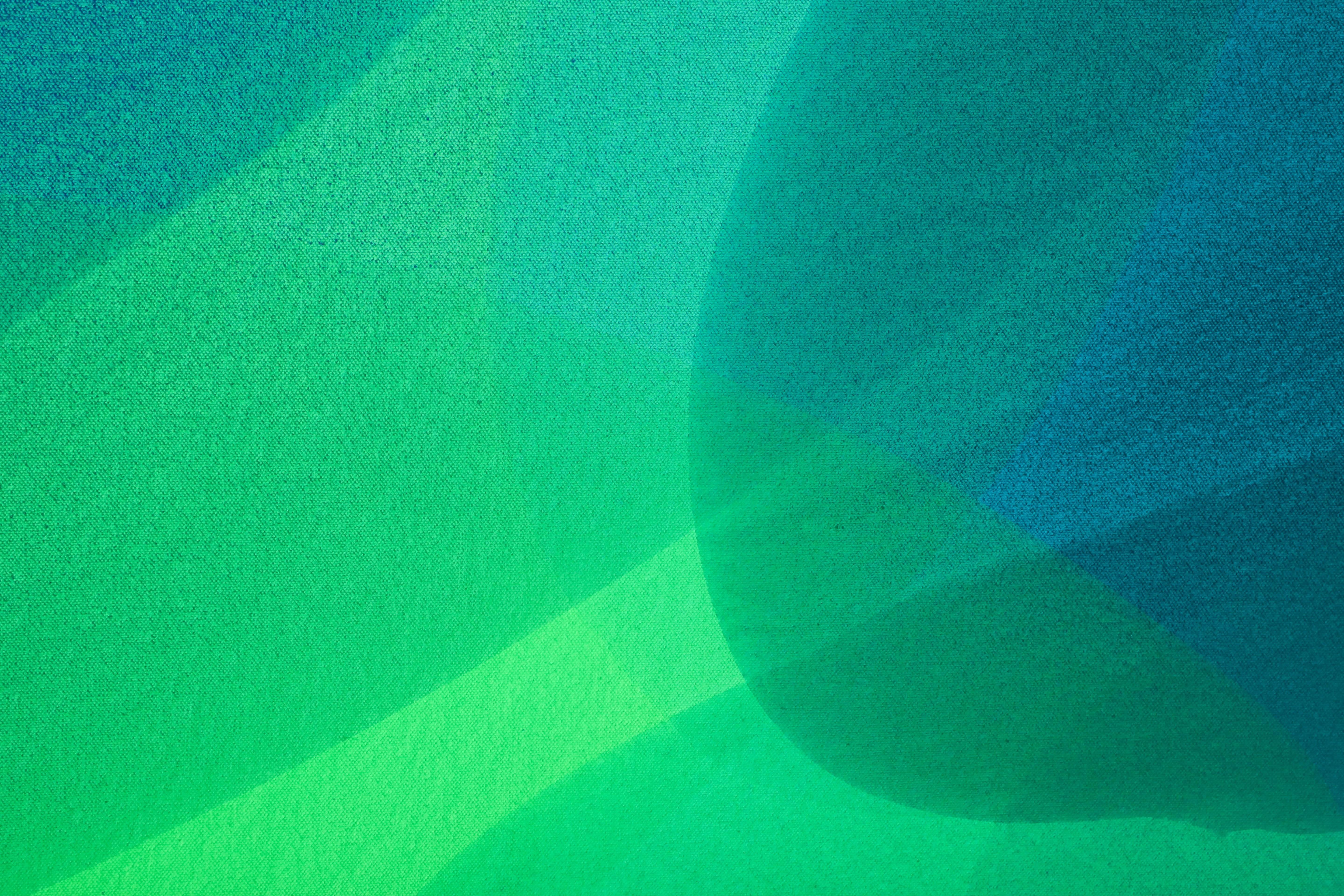 Calming hues of blues, greens and turquoises meld together in this serene abstract piece by William Engel. The diffusion of one color into the next mimics beams of light interconnecting with one another. Soft circular shapes and curves give a