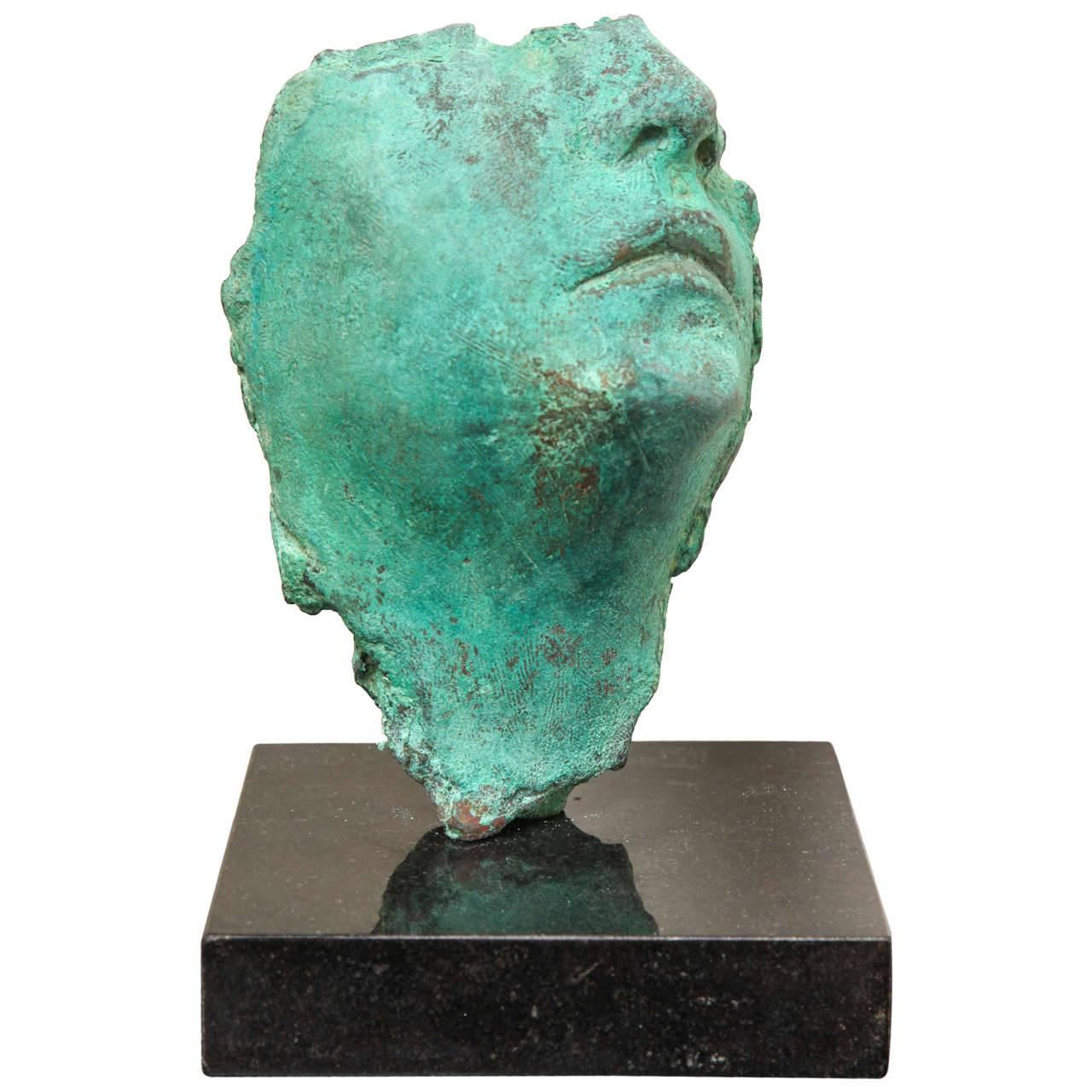 The cast bronze with green patina on granite base is a unique sculpture by the artist. This one-of-a-kind piece. Looks/feels like Gods of Small Things. Piece of Art is signed  by the artist.