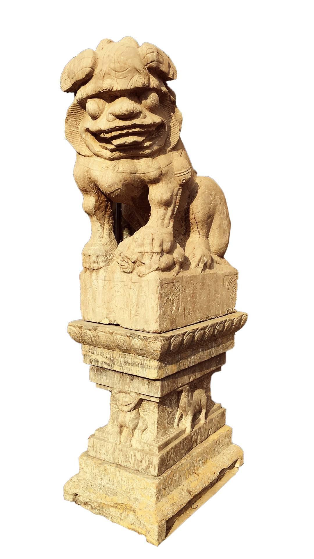These majestic creatures are c. 1800 (Qing Dynasty). This pair of These limestone guardians are displayed on carved bases 

Together with their carved bases they stand 96” tall. The dimensions for the lions are 19” x 31” x 48”. The bases measure 22”