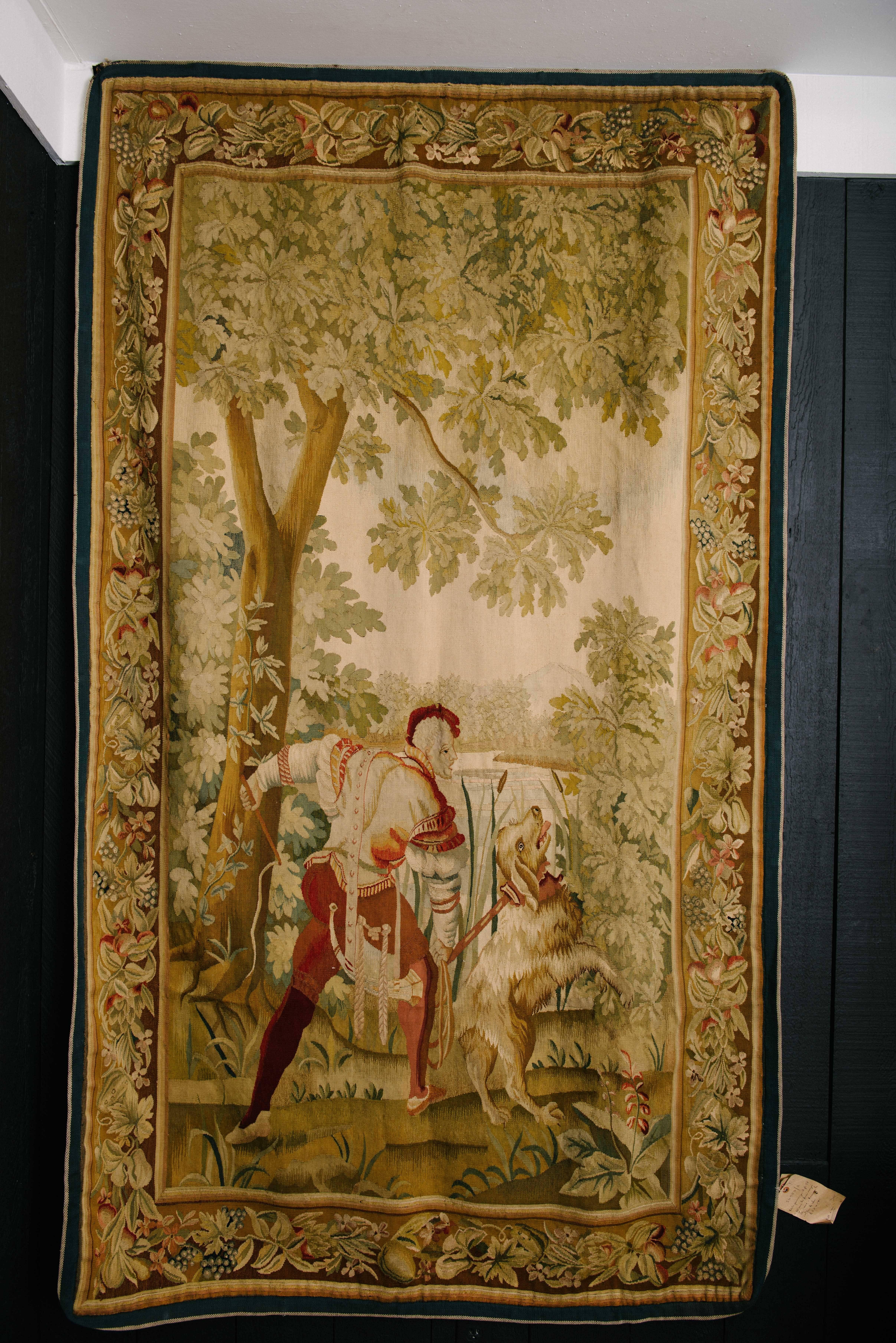 Rare pair of early 19th century French Louis Philippe Aubusson tapestries each depicting a figure, a dog and beautiful foliage.

Please click KIRBY ANTIQUES logo below to view additional pieces from our vast inventory.
 