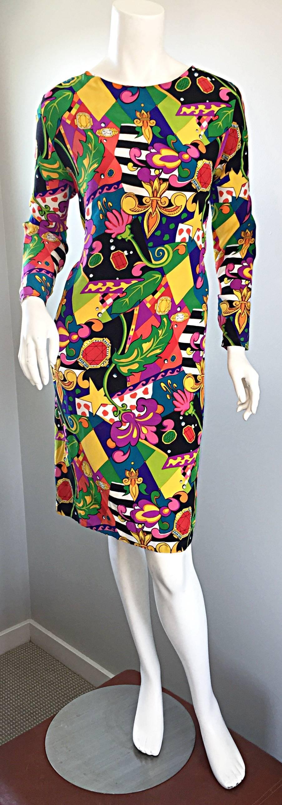 Amazing vintage I. Magnin silk printed dress! Multi layered prints of jewels, stars, fleur de lys, flowers, playing cards, stripes, harlequins, leaves, etc.!!! Slimming fit, that is perfect for a variety of occasions. Looks great alone, or belted.