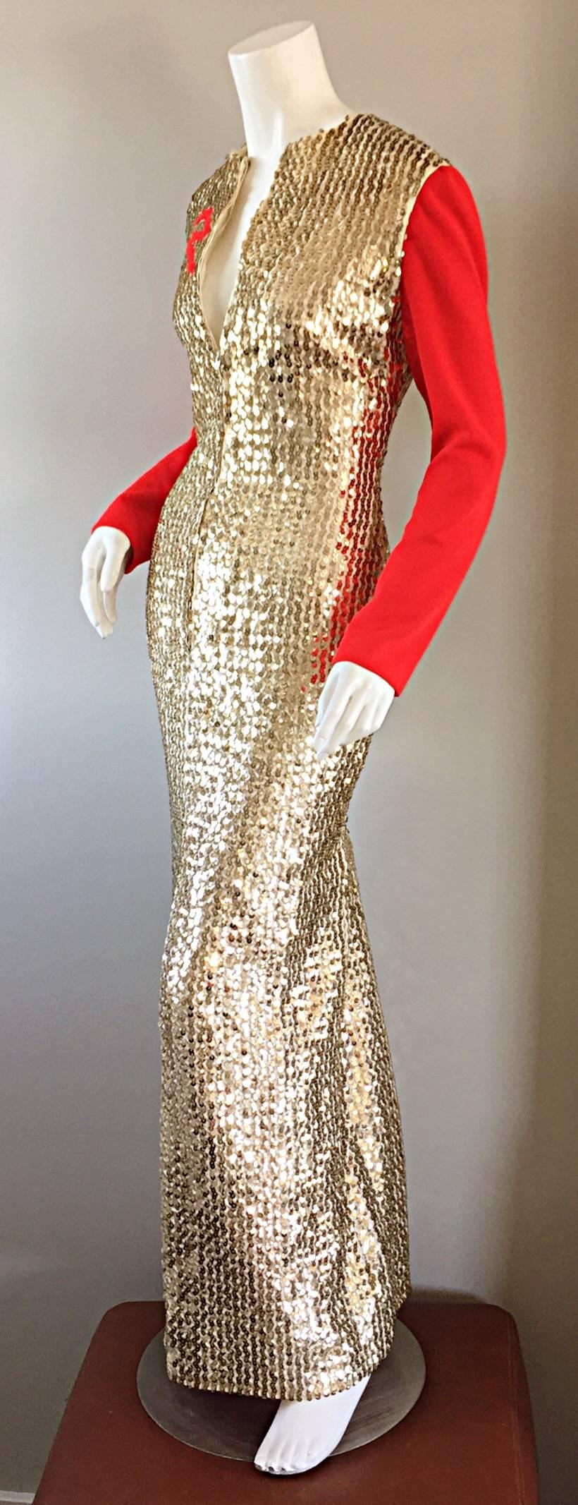 Amazing AND Rare Vintage Oscar de la Renta gold sequin dress! Embroidered with a "Red Ribbon" on the right breast. Sleek long red sleeves, and a zipper down the bodice. Encrusted with thousands of hand-sewn gold sequins. Sexy slit up the