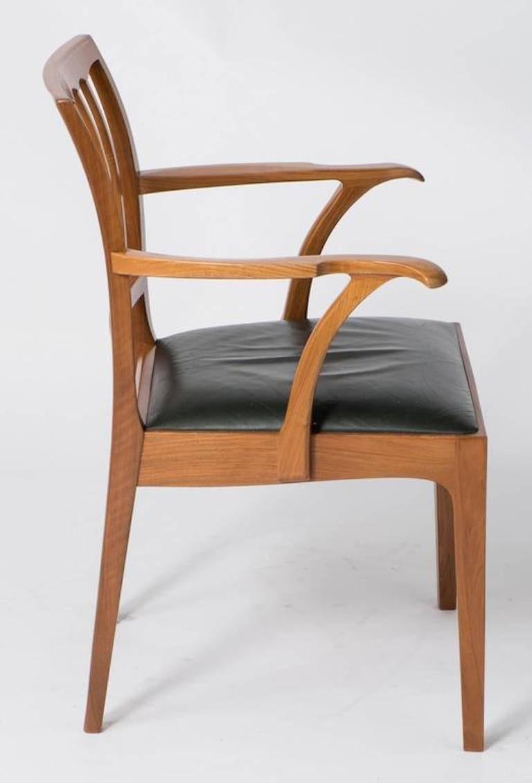 A set of eight walnut chairs by Edward Barnsley.
Two carvers and six side chairs, 
England, circa 1971
Stamped Barnsley
Made for a wedding present.
Measures: Chairs 84 cm high x 45 cm wide x 45 cm deep
Carvers 88 cm high x 60 cm wide x 48 cm