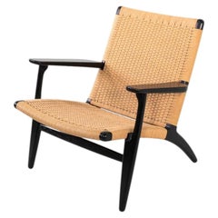 Años 2010: Sillón CH25 de Hans Wegner para Carl Hansen, en roble ebonizado y cordón trenzado