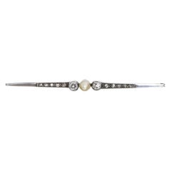 Gold and silver barrette pin with diamonds.