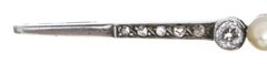 Gold and silver barrette pin with diamonds.