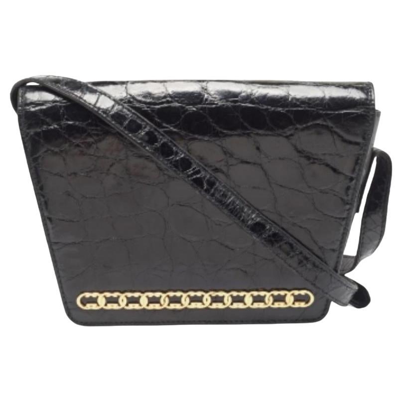 Gucci Borsa a tracolla con patta GG in pelle di coccodrillo nera in vendita
