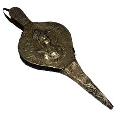 Antique Fireplace Bellows in Embossed Brass Representing a Woman