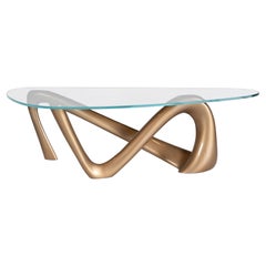 Amorph Iris Coffee Table in metallic gold lacquer with glass top