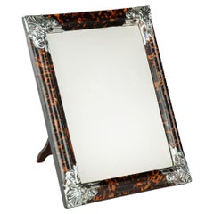 A large Art Deco silver mounted tortoiseshell easel mirror