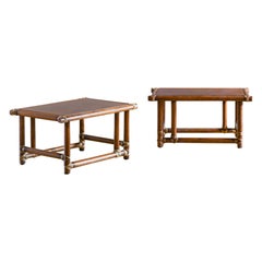 Pair of wooden tables with leather bindings by Lyda Levi - McGuire