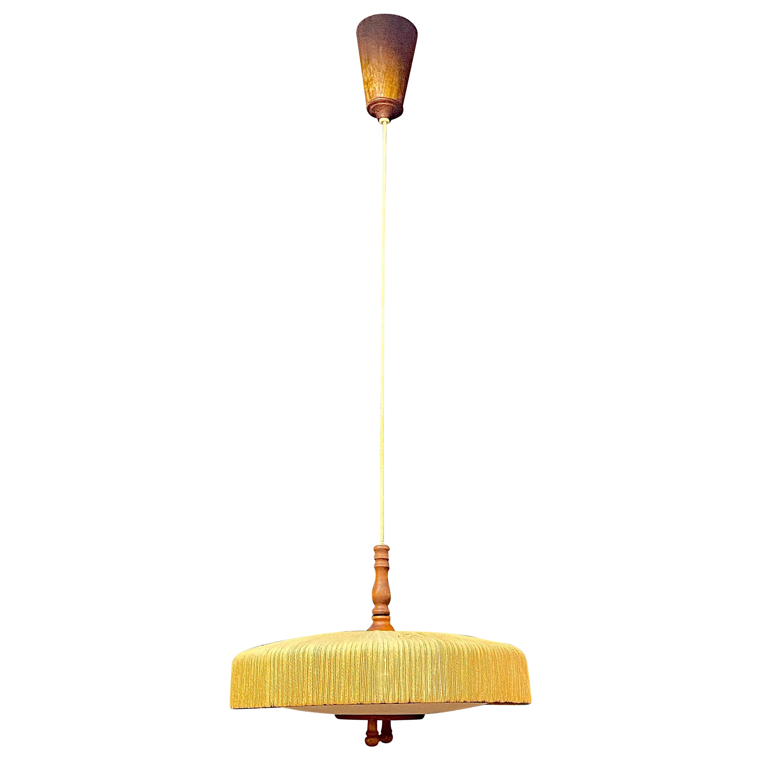 Scandinavian chandelier, rises and falls, in teak and rope circa 1960  For Sale