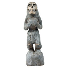 African Ivory Coast 20th Century Wood Composite Baule Monkey Figure with Skull