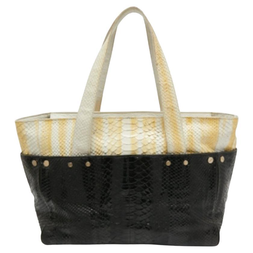 Bolso con cremallera MCM en piel estampada pitón amarillo/negro