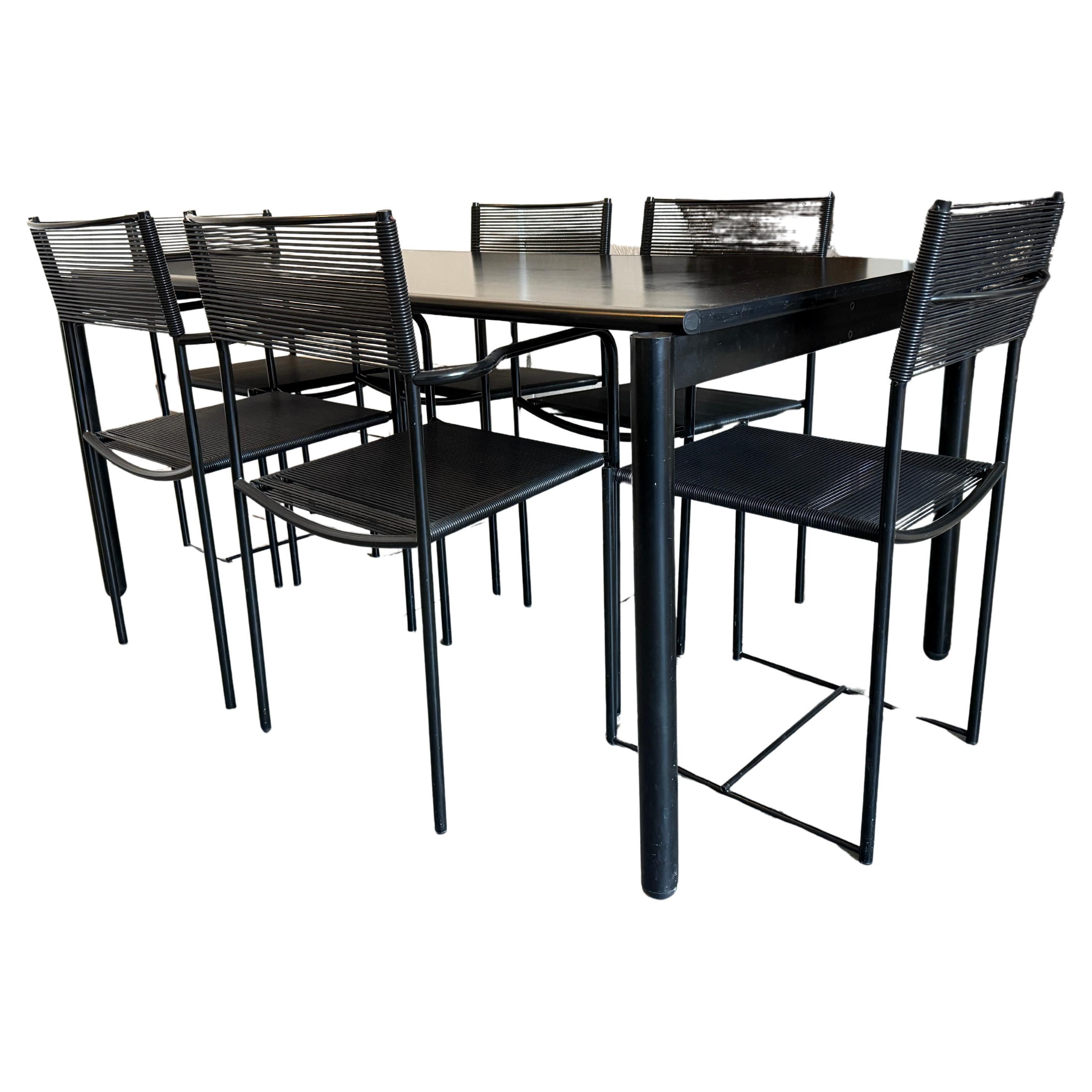Original Spaghetti Patio chairs and matching rectangular table with reversible top in all Black by Giandomenico Belotti for Alias Made in Italy. Gorgeous Minimalist Italian design from the Pop Art era. Very good condition with barely any wear or use